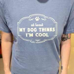 Person wearing "My Dog Thinks I'm Cool" shirt.