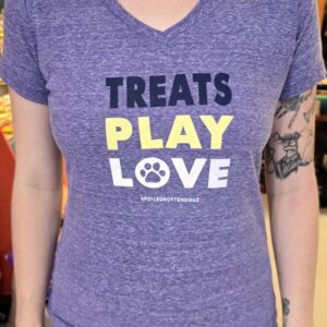 Person wearing "Treats Play Love" shirt.
