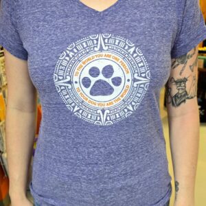Woman wearing a blue paw print shirt.