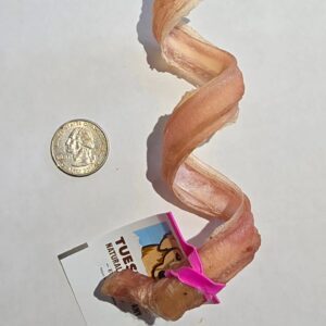 Bacon strip, quarter coin, and calendar page.