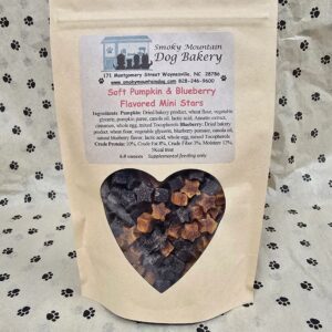 Dog treats in heart-shaped windowed bag.