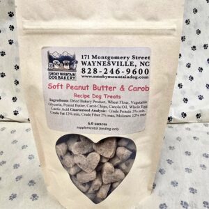 Dog treats in heart-shaped packaging.