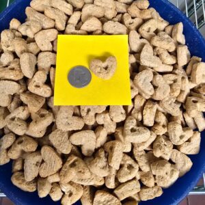 Heart-shaped cereal pieces with a coin.
