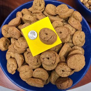 Bowl of cookies with a coin.
