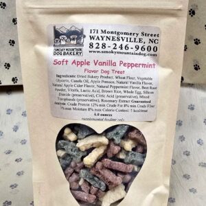 Dog treats in heart-shaped window packaging.