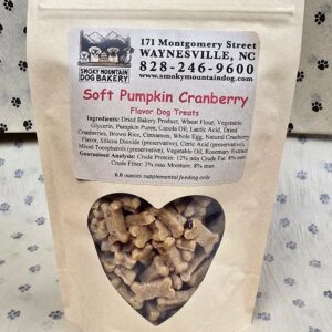 Dog treats in a brown paper bag.