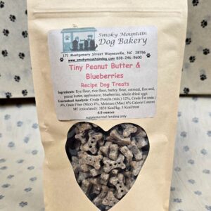 Dog treats in a brown paper bag.