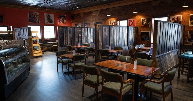 Cozy cafe interior with wooden partitions.